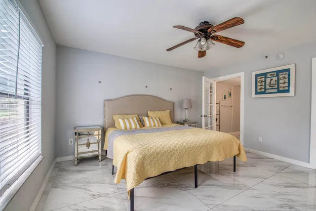 a bedroom with a bed and window