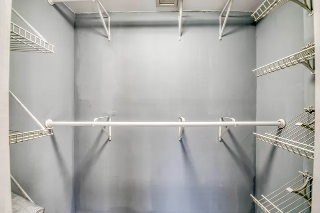 a view of a room with racks on the wall