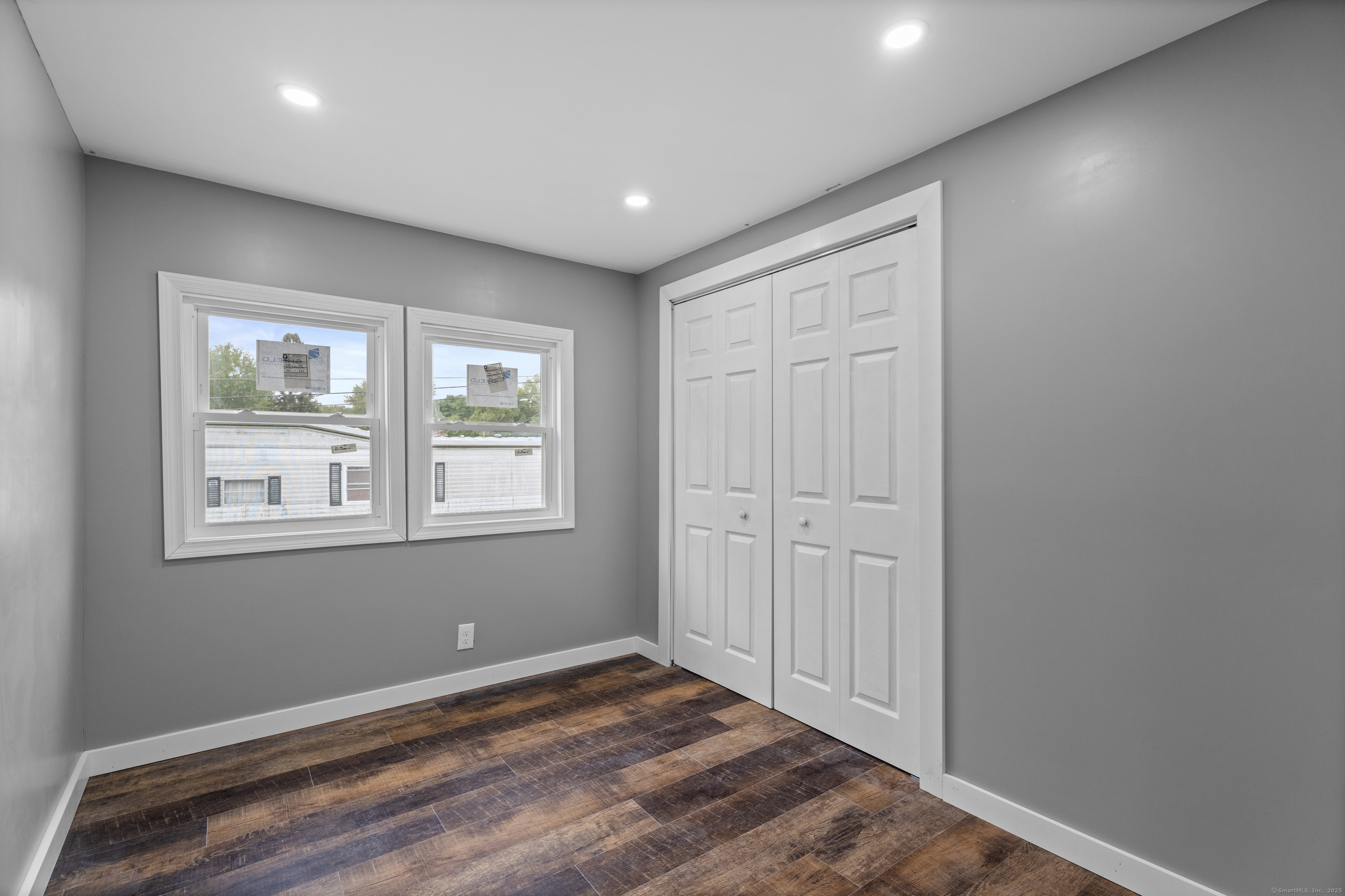 80 Sheldon Road Griswold, CT 06351 - Photo 16 of 24 a view of an empty room with wooden floor and a window