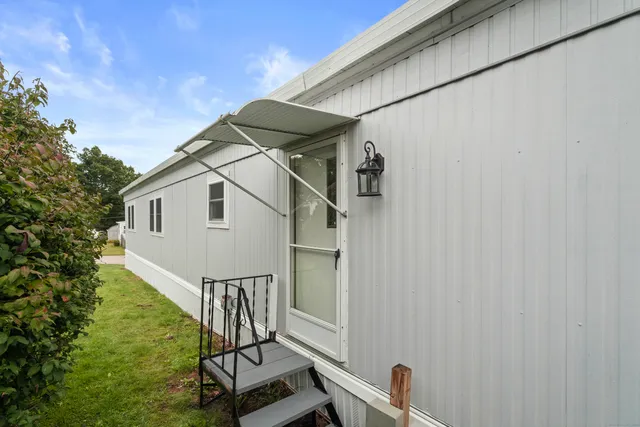 an aerial view of lake residential houses with outdoor space and lake view
