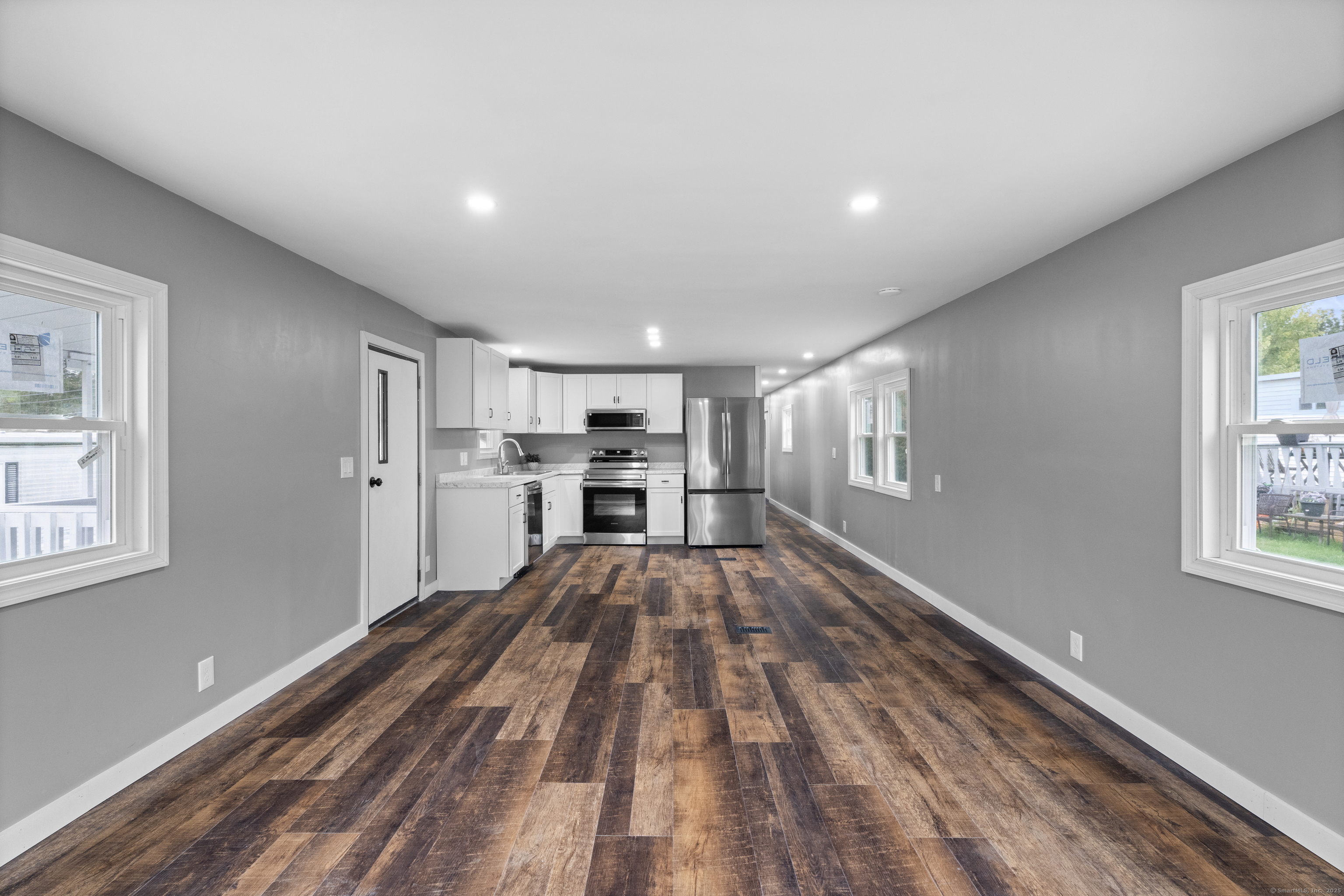 80 Sheldon Road Griswold, CT 06351 - Photo 4 of 24 a view of kitchen with wooden floor and window