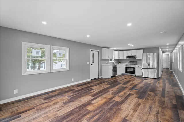 a view of kitchen with wooden floor
