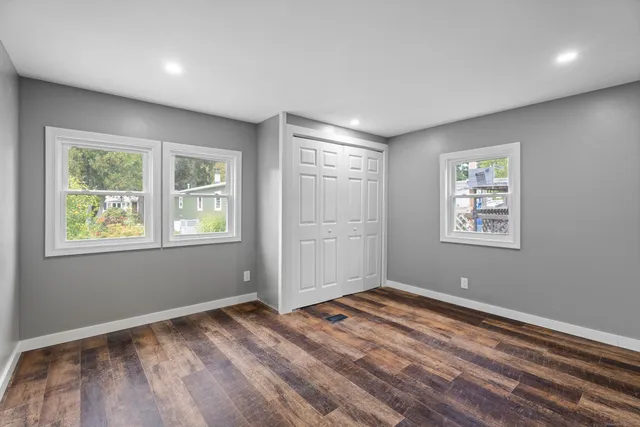 a view of room with window and hardwood floor