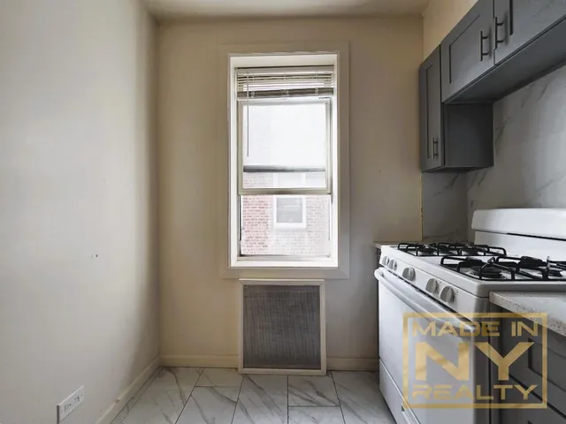 a kitchen with a stove and a microwave