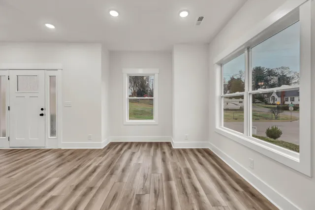a view of an empty room with a window