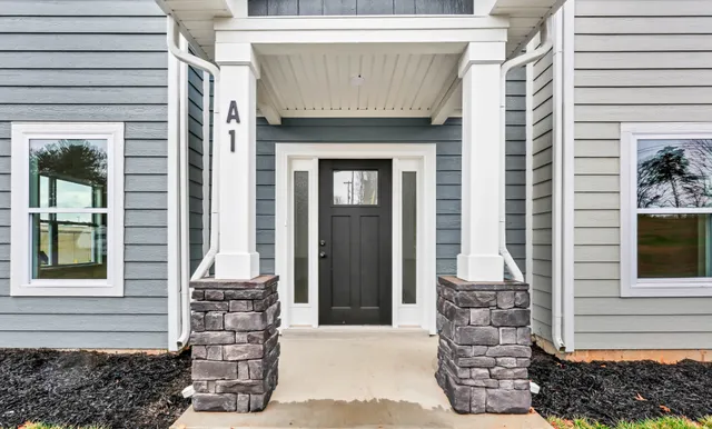 a front view of a house with a yard