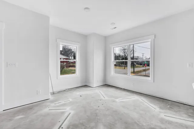 an empty room with windows