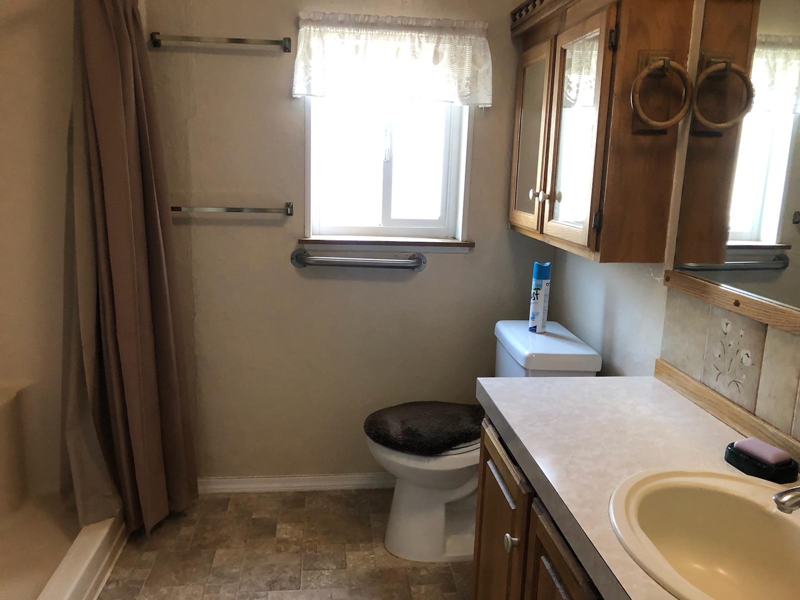 22325 Brent Road Red Bluff, CA 96080 - Photo 11 of 36 a bathroom with a sink and a toilet