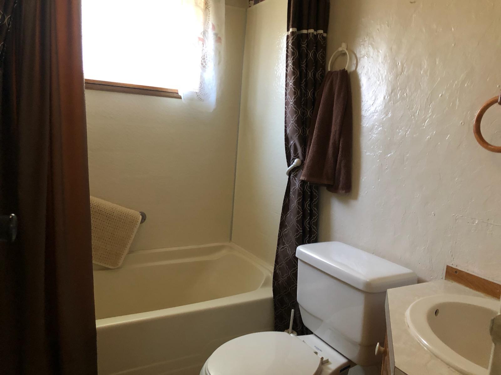 22325 Brent Road Red Bluff, CA 96080 - Photo 15 of 36 a bathroom with a toilet and a shower