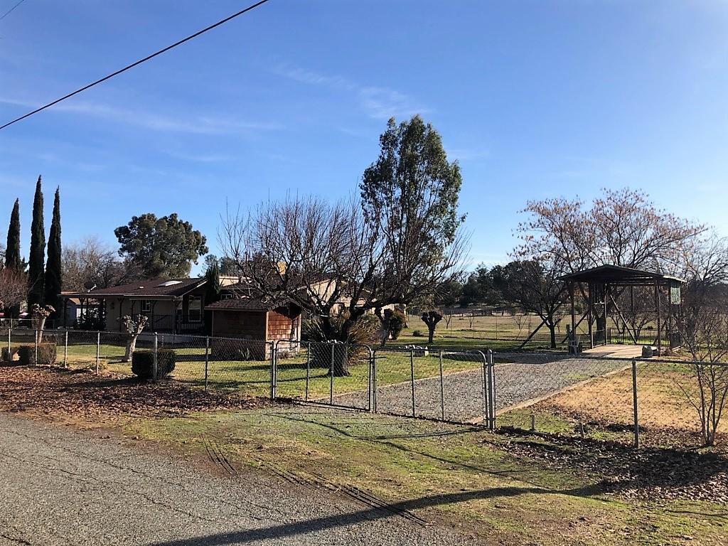 22325 Brent Road Red Bluff, CA 96080 - Photo 18 of 36 a view of a park with swings on the wall