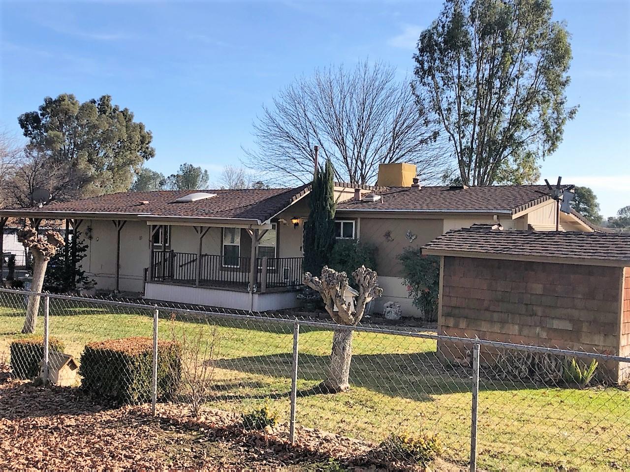 22325 Brent Road Red Bluff, CA 96080 - Photo 20 of 36 a view of a house with swimming pool and a yard