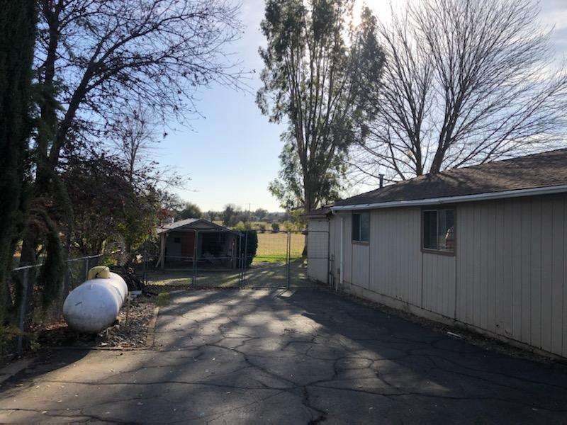 22325 Brent Road Red Bluff, CA 96080 - Photo 22 of 36 a backyard of a house with table and chairs