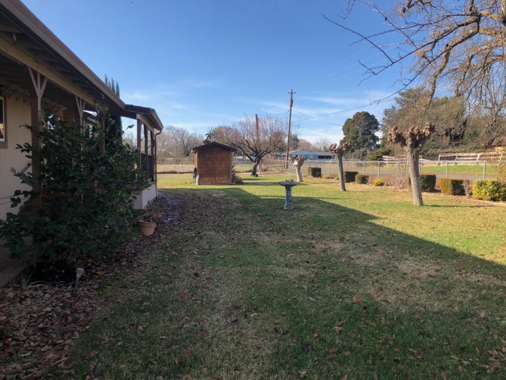 22325 Brent Road Red Bluff, CA 96080 - Photo 24 of 36 a backyard of a house with lots of green space
