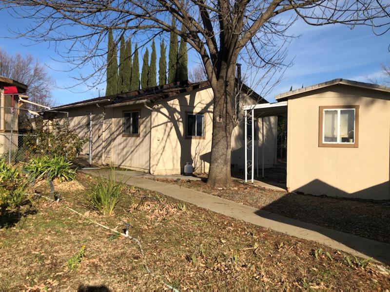 22325 Brent Road Red Bluff, CA 96080 - Photo 34 of 36 a front view of a house with a yard
