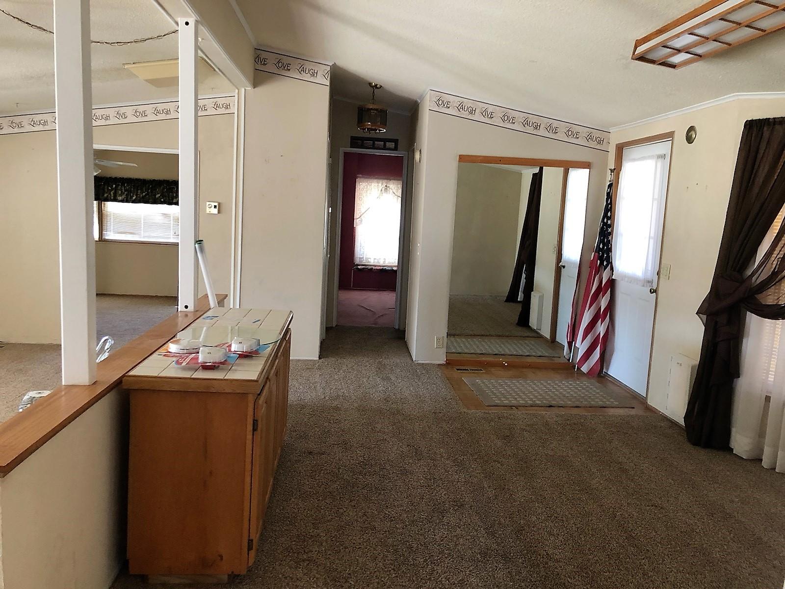 22325 Brent Road Red Bluff, CA 96080 - Photo 4 of 36 a hall way with furniture and a mirror