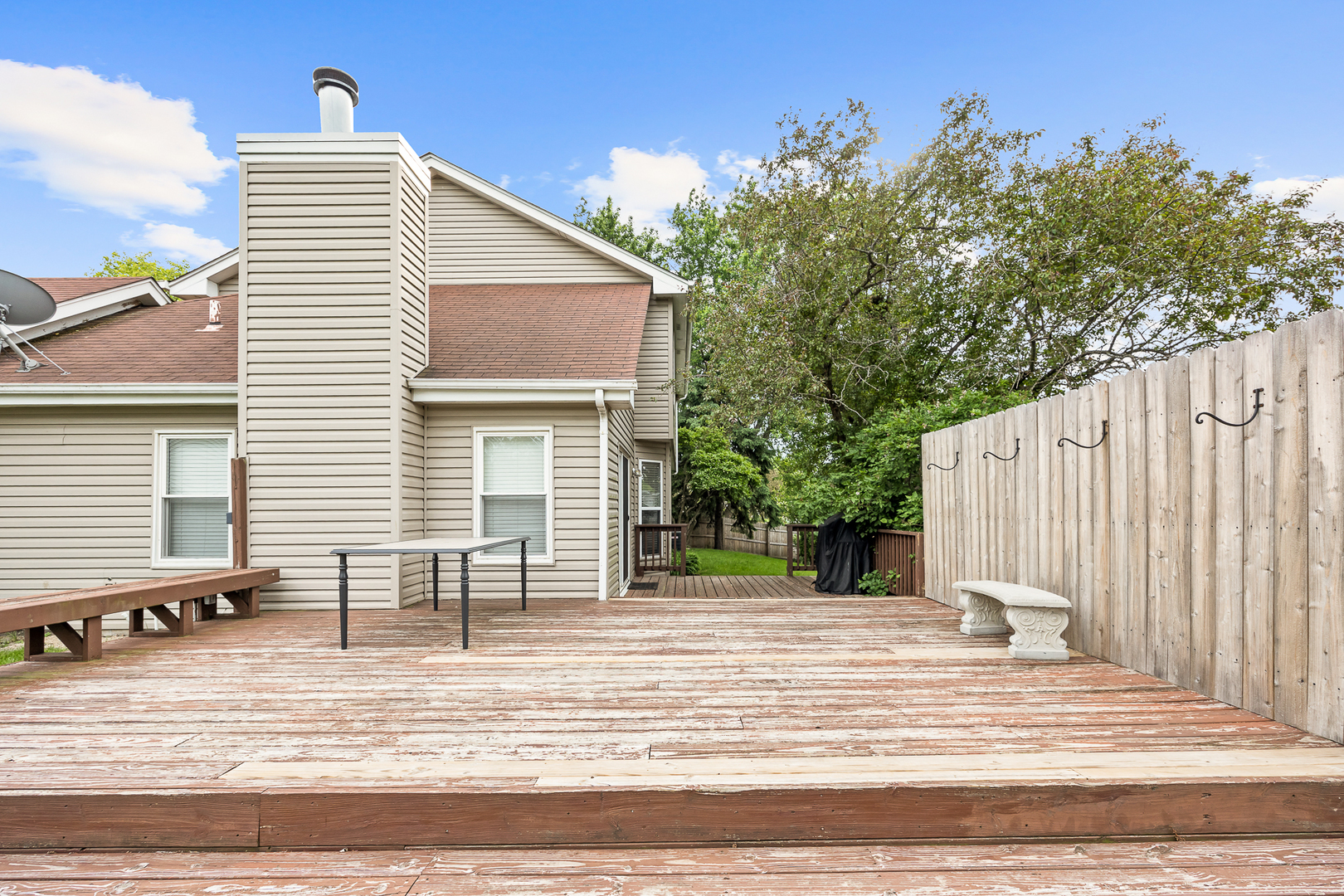 2 Buckboard Court Bolingbrook, IL 60490 - Photo 6 of 33 a view of a patio with table and chairs with wooden fence