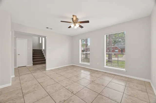a view of an empty room with a window