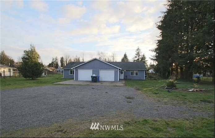 10241 183rd Way Southwest Rochester, WA 98579 - Photo 1 of 1 a view of a large house with a big yard plants and large trees