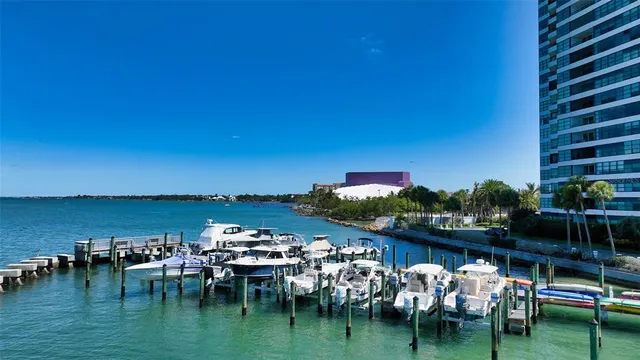 a view of a swimming pool with a table and chairs