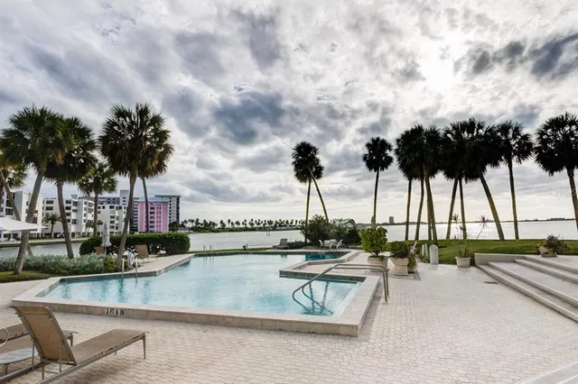 an aerial view of a house with a lake view