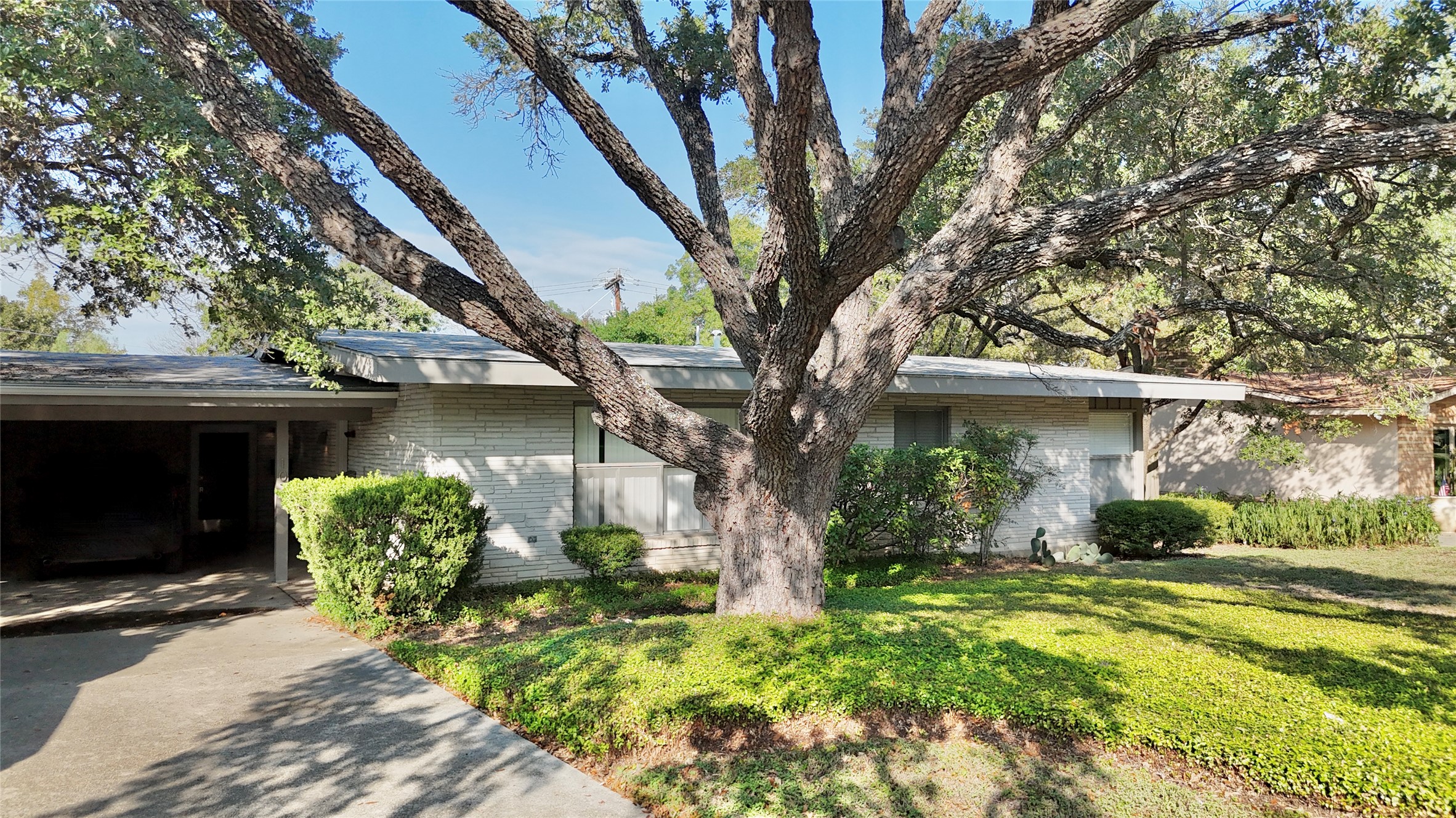107 El Rancho Way, Unit 103 & 107 San Antonio, TX 78209 - Photo 1 of 1 a front view of a house with garden