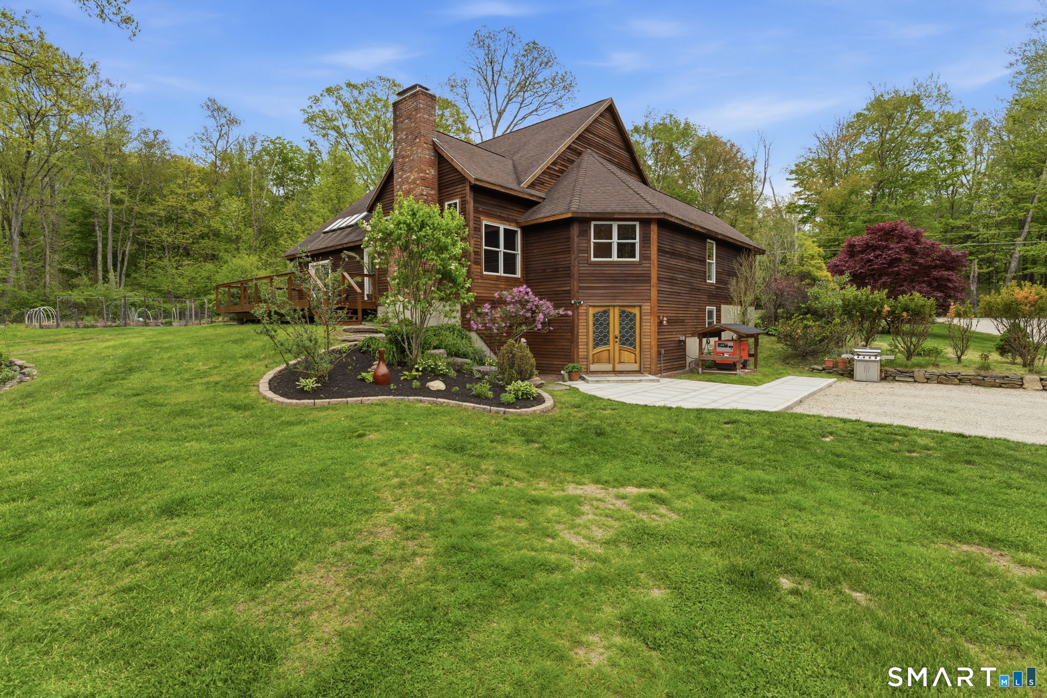 287 South Bear Hill Road Chaplin, CT 06235 - Photo 3 of 37 a front view of a house with garden