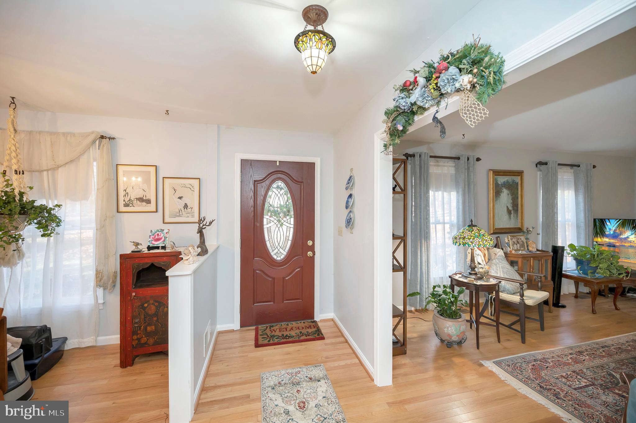 18 Winslow Road Fredericksburg, VA 22406 - Photo 16 of 49 a living room with furniture a window and a chandelier