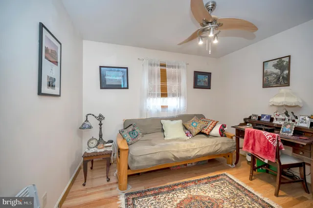 a living room with furniture and a rug
