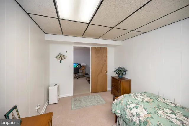 a bedroom with a bed and a table