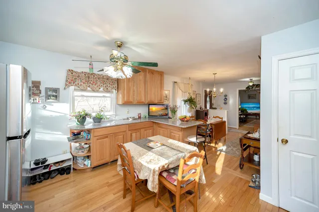 a very nice looking dining room with a table and chairs in it