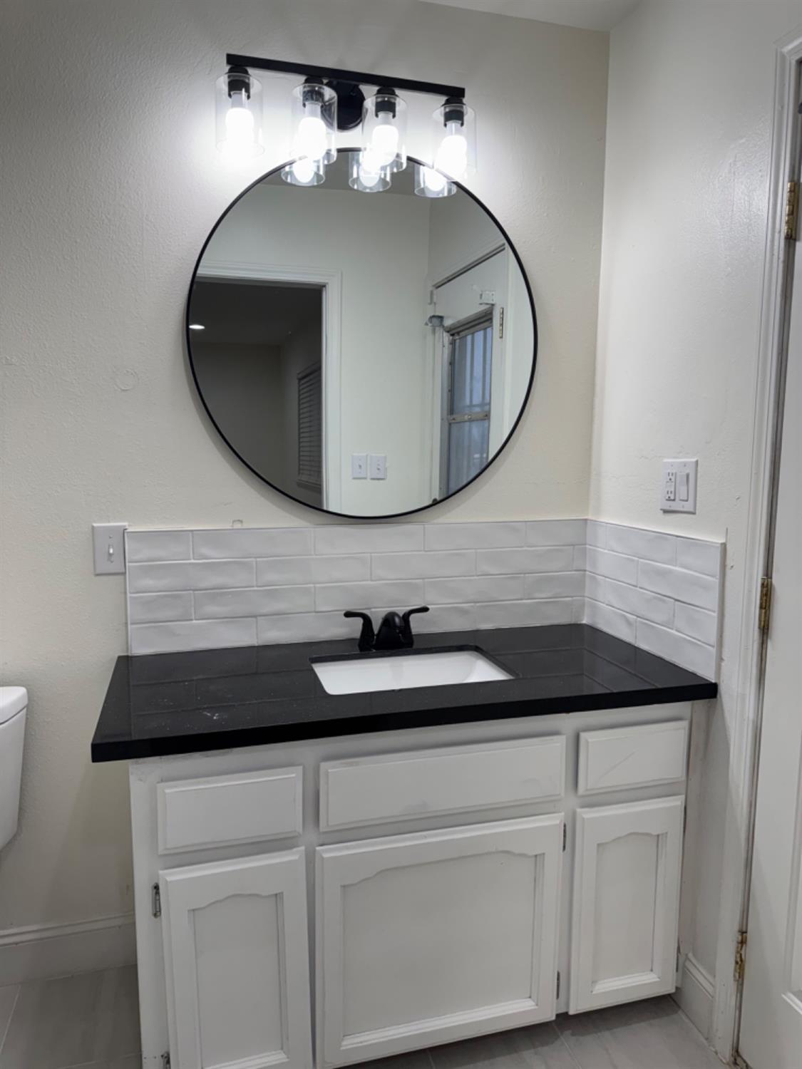 17269 Mark Road Madera, CA 93636 - Photo 12 of 23 a bathroom with a sink and a mirror