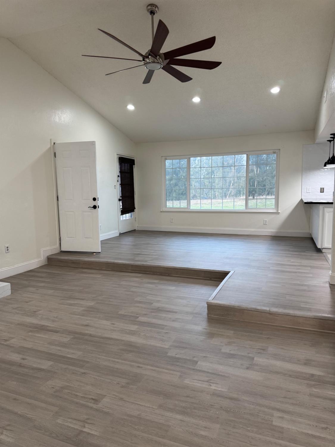 17269 Mark Road Madera, CA 93636 - Photo 20 of 23 a view of a room with a ceiling fan and a window