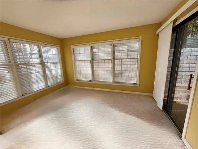 a front view of a house with a large window