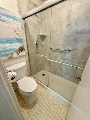 a view of an empty room with a staircase