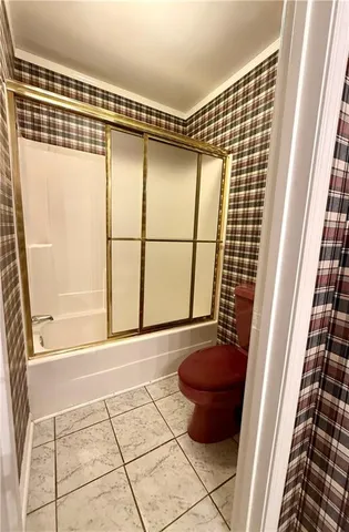 a stove top oven sitting inside of a kitchen