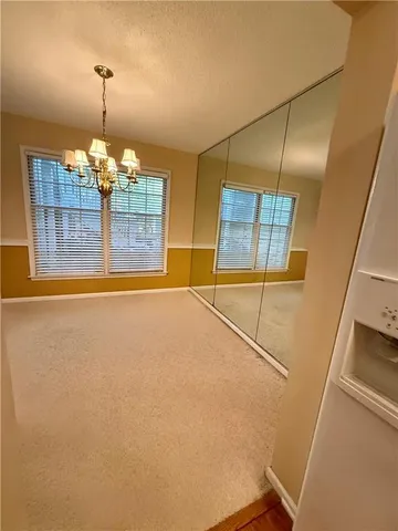 a view of a livingroom with a fireplace and a window