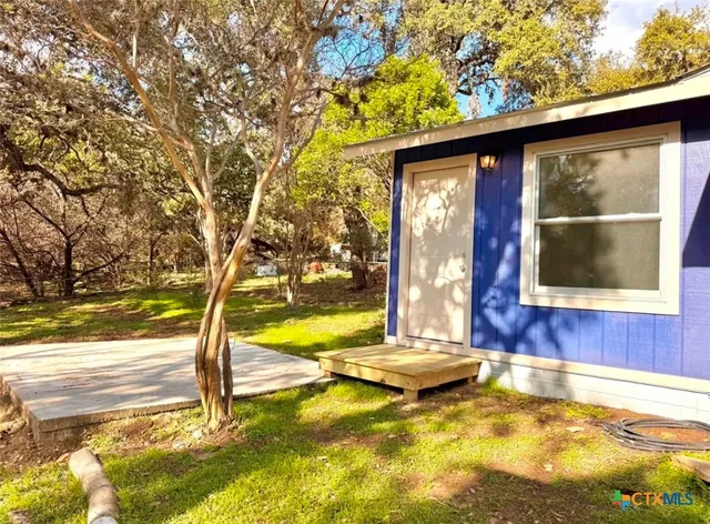 a view of swimming pool with a yard