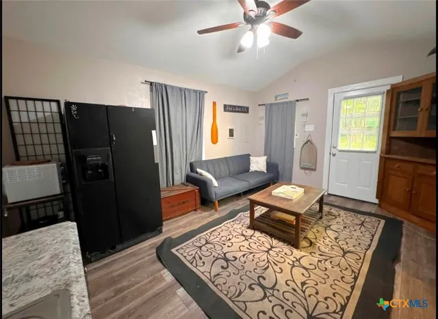 a living room with furniture and a rug