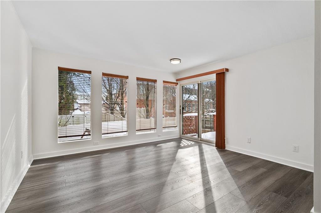 2923 Fernwald Road Pittsburgh, PA 15217 - Photo 11 of 36 a view of an empty room with wooden floor and a window