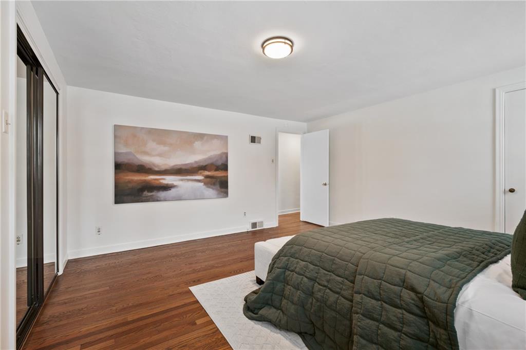 2923 Fernwald Road Pittsburgh, PA 15217 - Photo 19 of 36 a bedroom with a bed and painting on the wall