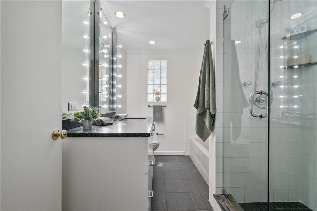 2923 Fernwald Road Pittsburgh, PA 15217 - Photo 20 of 36 a bathroom with a double vanity sink a mirror and shower
