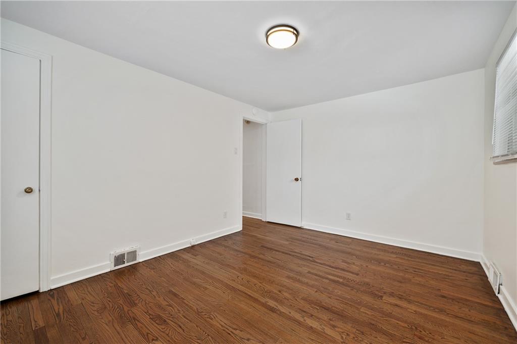 2923 Fernwald Road Pittsburgh, PA 15217 - Photo 22 of 36 a view of an empty room with wooden floor