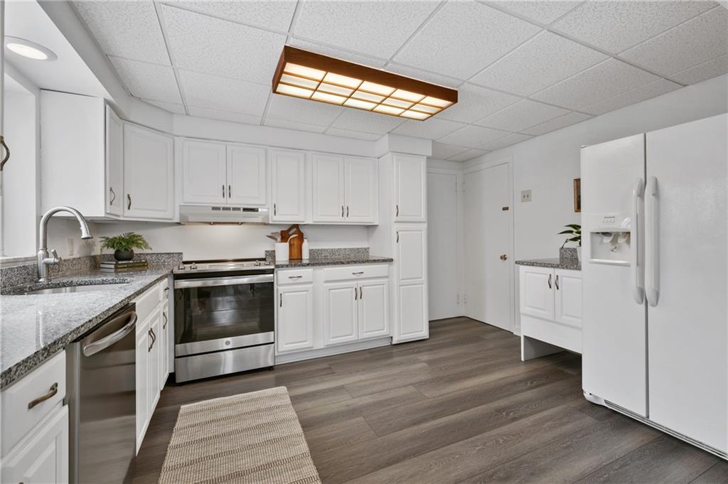 2923 Fernwald Road Pittsburgh, PA 15217 - Photo 9 of 36 a kitchen with cabinets stainless steel appliances and a counter space