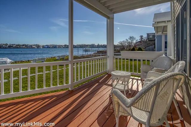 a view of a balcony with wooden floor