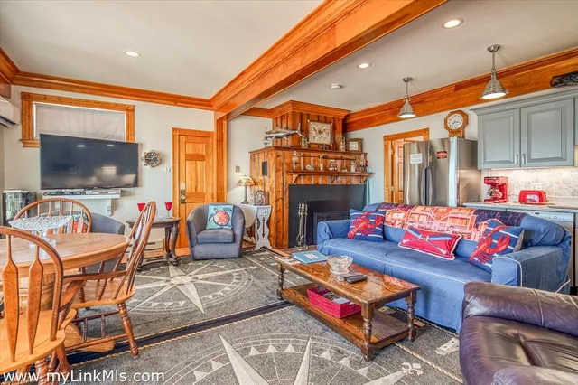 a outdoor living space with furniture and a flat screen tv