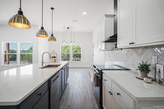 a view of kitchen and sink with wooden floor