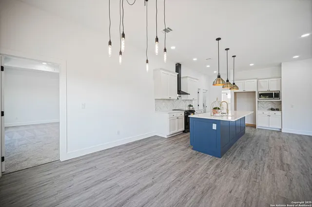 a view of hallway with wooden floor