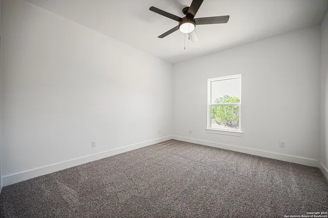 a view of a back yard from a balcony
