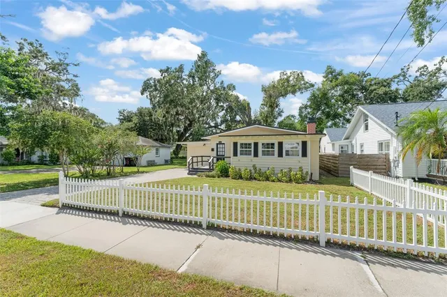 a view of a house with a street view and a fence