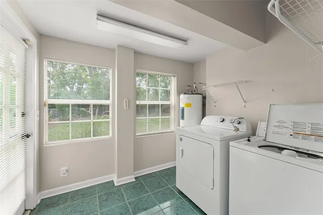a view of storage and utility room with washer and dryer